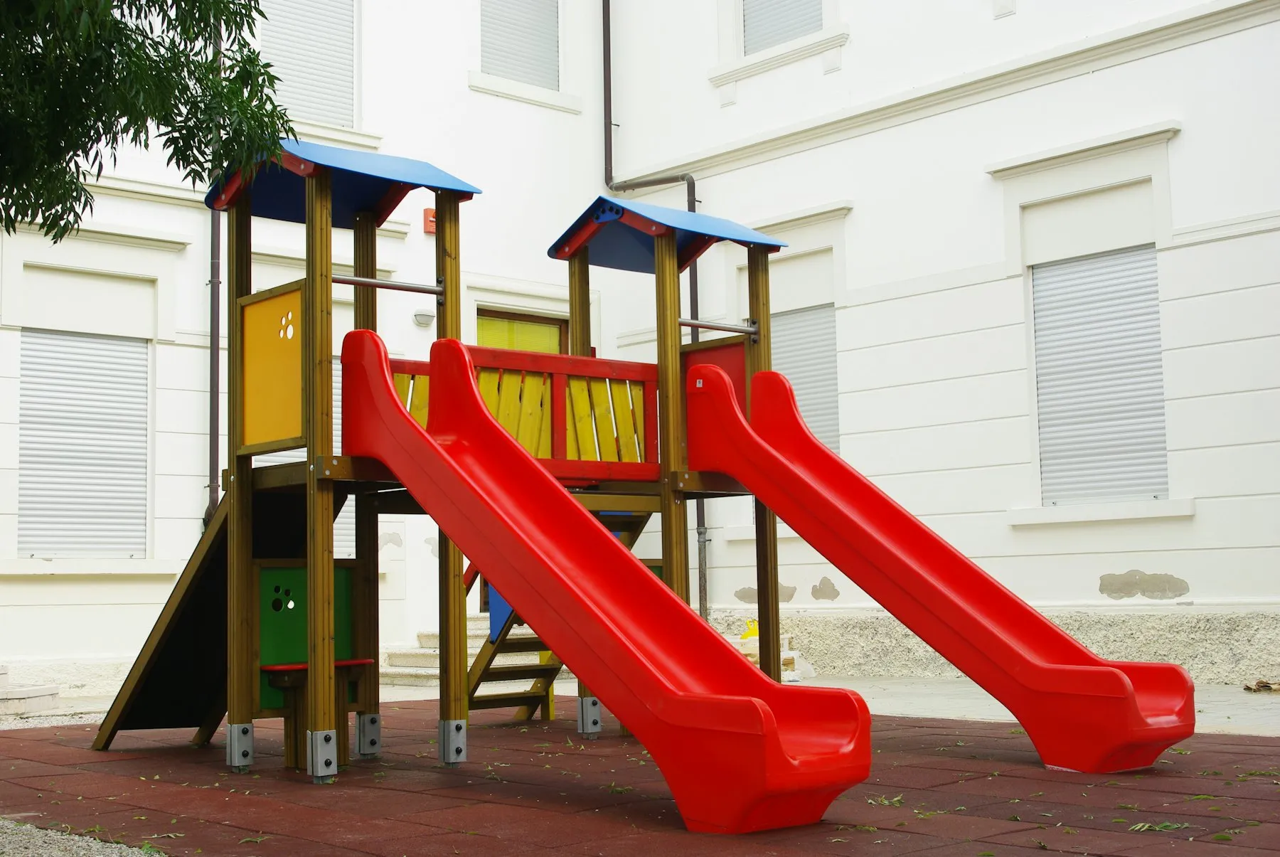 Playground with red and yellow slides